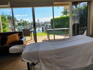 mobile massage table in front of window