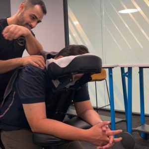 Jeremy massaging a client in a massage chair