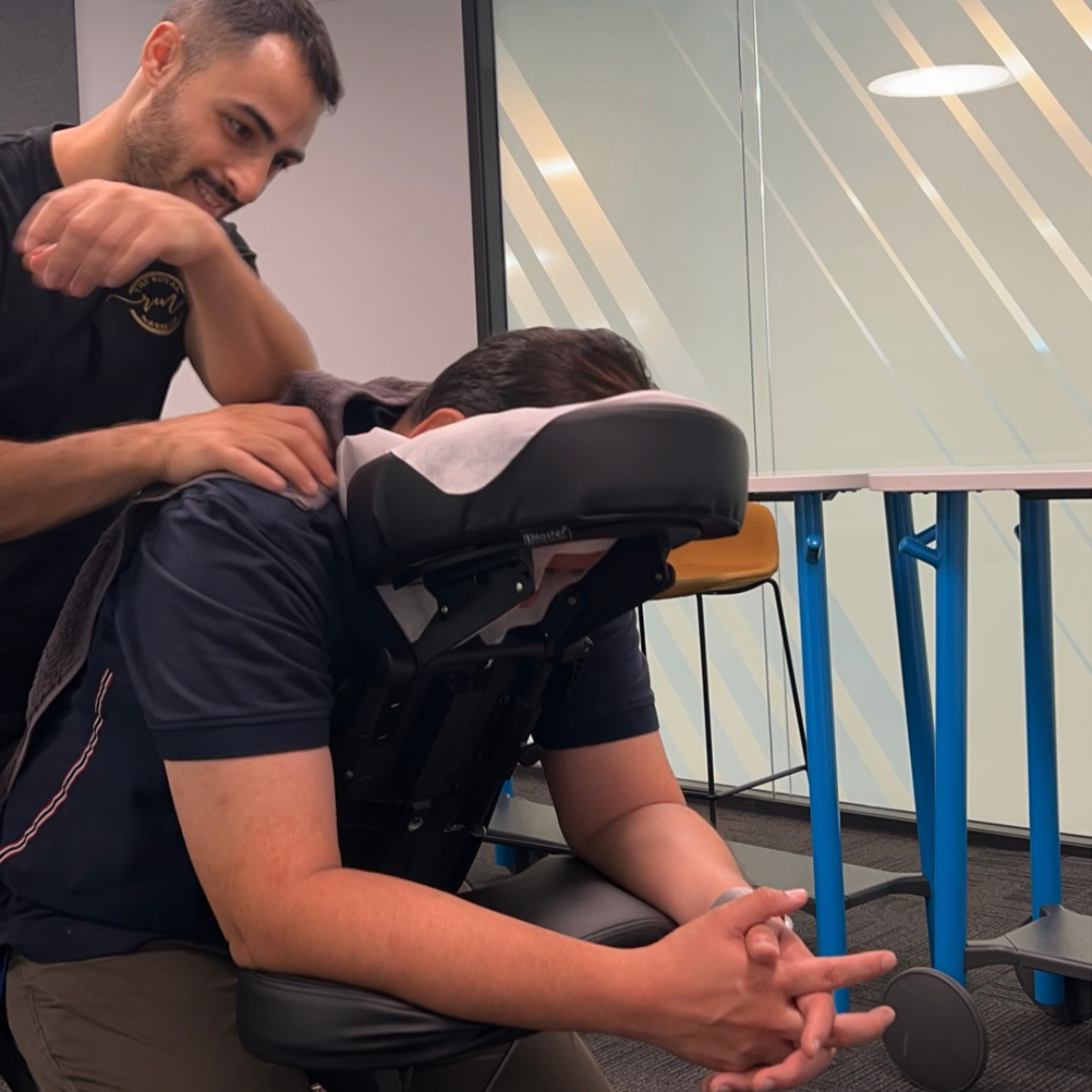 Jeremy massaging a client in a massage chair