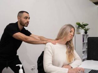 Jeremy massaging a lady at work